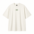 Camiseta oversized off-white VYBEE com logo verde no peito